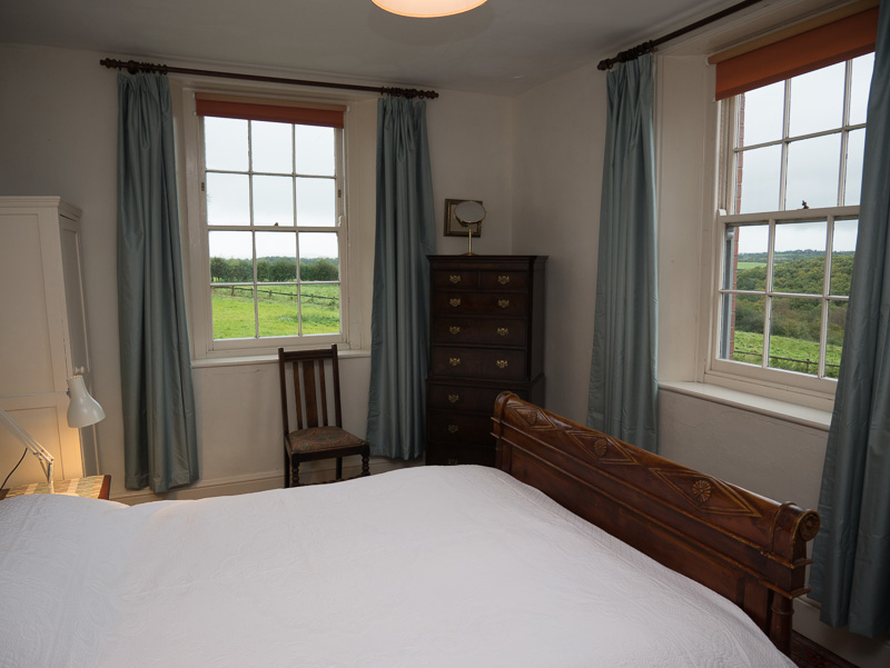 double bedroom with view to woods